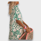 Dlouhé šaty s květinovým vzorem a knoflíky