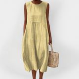 Elegantní bezrukávové bavlněné šaty s kapsami