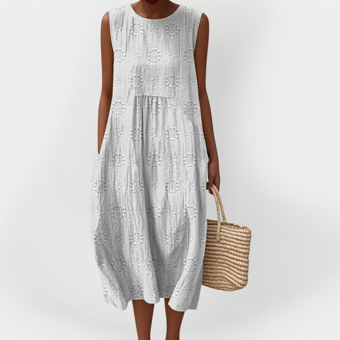 Elegantní bezrukávové bavlněné šaty s kapsami