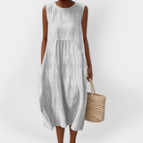 Elegantní bezrukávové bavlněné šaty s kapsami