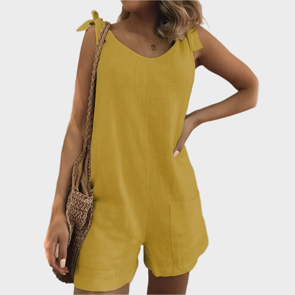 Dlouhý overal s mašlemi a kapsami