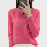 Pletený rolák s motivem motýla